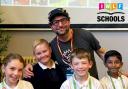 Andy Stanton with pupils at an Island primary school