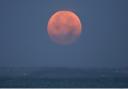 October Hunter's Super Moon setting, seen from Totland Bay