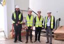 JD Viette (project manager for Aspire), John Prickett, Trevor Nicholas and Councillor Phil Jordan at Aspire where new housing units are being created