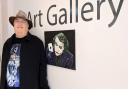 Clive Redfern Burrows with his Joker painting