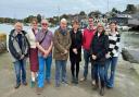 Representatives from Wootton Creek Fairway Association, Wootton Bridge Parish Council and Fishbourne Parish Council in front of Wootton Creek.