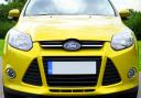 Stock image of a yellow Ford Focus