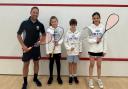 Finn Husson, Olivia Holbrook and Millie Holbrook with their coach Adam Dominey