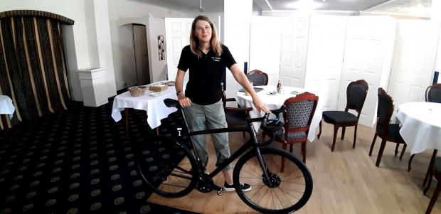 Isle of Wight County Press: Karen Stritton with Museeuw's bike at the Eversley Hotel in Ventnor.