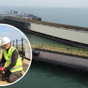 Works to install a new walkway on Ryde Pier. Inset: Andy Whitlock from Knights Brown screws in the final plank with Wightlink’s Dean Murphy.