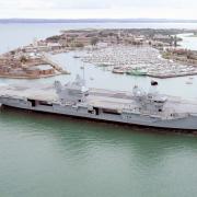 The HMS Prince of Wales aircraft carrier returns to Portsmouth Harbour.