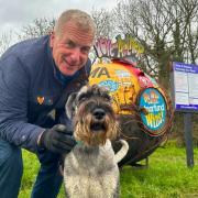 Dog walker Glyn Jenkins and his three-year-old Schnauzer, Rusty, at the Honesty Pay and Display near Carisbrooke Castle