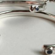 A silver bangle with a blue gem, similar to this one, went missing.
