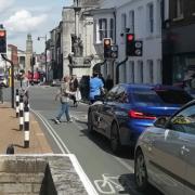 Traffic lights at the junction of Newport High Street and St James' Street