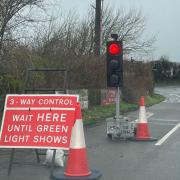 Temporary traffic lights on the Downs Road at the Downend junction