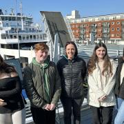 Travel and Tourism students Zakiya, Ewan, Abbie and Uliana with Isle of Wight College tutor Lindsay Davies