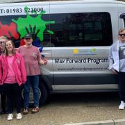 Tracey Hill, CEO of The Way Forward (right) and some of those involved with the charity, in front of the minibus