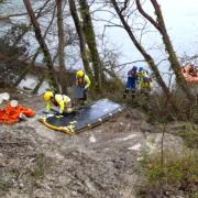 Hampshire and Isle of Wight Fire and Rescue Service crewmen and Coastguard teams doing mud rescue training together.