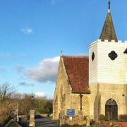 The iconic white tower at the church in Newchurch