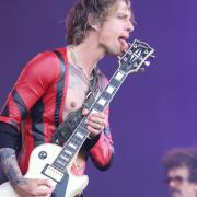 The Darkness on stage at the Isle of Wight Festival