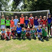 Mille Tinsley and Jess Green with participants of the two-day football camp