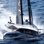 Britannia celebrate winning the Louis Vuitton Cup, to book their place in the 37th Americas Cup final against New Zealand on October 12.