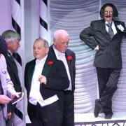 A scene from The Mikado, being performed at Bembridge Village Hall.