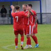 Vics man of the match Elliott Wheeler and Newport celebrating away at league leaders Frimley Green