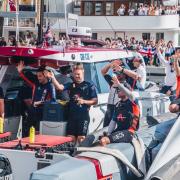 The INEOS Britannia team and British fans celebrate an excellent day in the America's Cup in Barcelona.