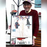 Marine artist Mike Miller, 80, with his America's Cup collage.