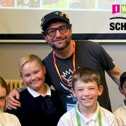 Andy Stanton with pupils at an Island primary school