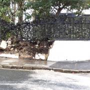 The garden wall destroyed in a car crash.