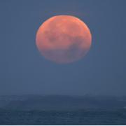 October Hunter's Super Moon setting, seen from Totland Bay