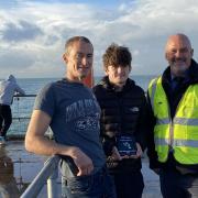 Award-winning angler Jay Smith with Colin Webb (left) and Martin Gulliver, Wightlink’s Island Ports Manager