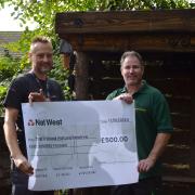 Colin Ringer presenting the cheque to Phillip