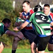 Michael Barrett (with the ball) scored two tries as the Hurricanes romped to victory