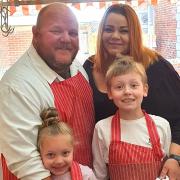 Island butcher Des Jarvis and his family.