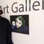 Clive Redfern Burrows with his Joker painting