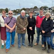 Representatives from Wootton Creek Fairway Association, Wootton Bridge Parish Council and Fishbourne Parish Council in front of Wootton Creek.