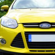 Stock image of a yellow Ford Focus