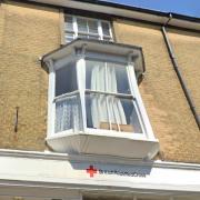 The flats will replace storage space above a former British Red Cross charity shop.