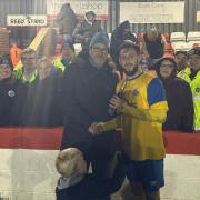 Newport's man of the match, Brad Young, picking up his award on behalf of sponsor Paul Guy.