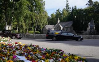 Queen Elizabeth II's coffin seen for first time as she begins her final journey