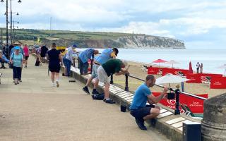 Businesses in the area donated painting supplies, while beachside cafés provided free refreshments