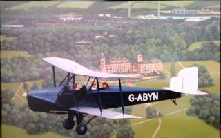 One of the Spartan bi-planes built on the Island, flying over Osborne House.