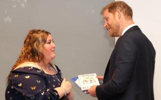 Islander Angela Turner shares a light moment with Prince Harry.