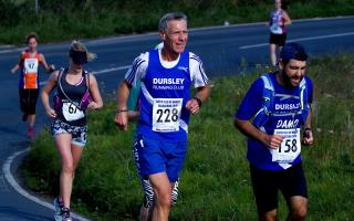 Returning runners David Saunders, centre, alongside his friend Damian from Dursley Running Club in the 2016 IW Marathon