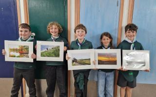 Jake, Eli, George, Megan and Oscar with their photographs.